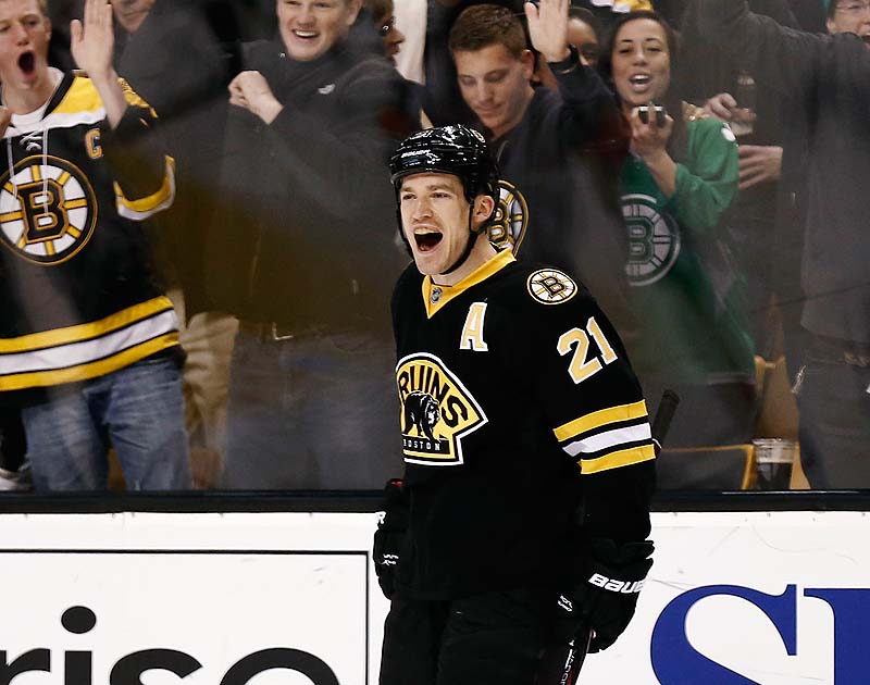 Fans celebrate with Boston Bruins' Andrew Ference after he scored against the Washington Capitals in the second period Saturday in Boston.