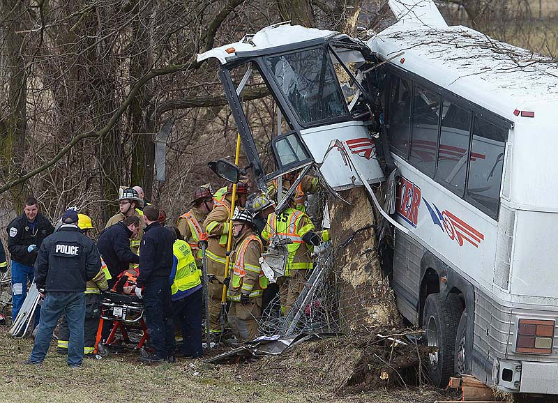 Emergency crews respond after a bus carrying the Seton Hill University women's lacrosse team crashed on the Pennsylvania Turnpike on Saturday near Carlisle, Pa.