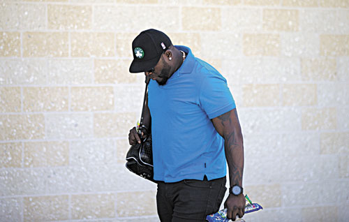 TAKING A BREAK: Boston’s David Ortiz leaves the clubhouse after meeting with trainers Sunday in Fort Myers, Fla. The Red Sox have decided to shut down Ortiz for seven to 10 day with a sore heel.