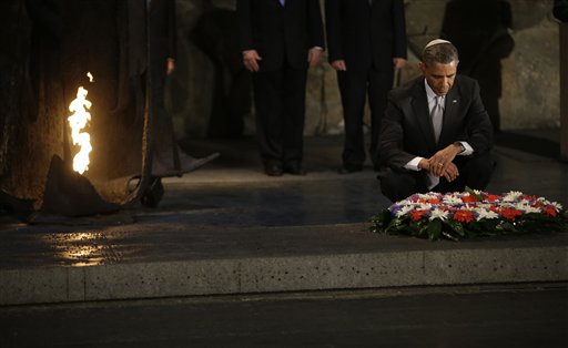 U.S. President Barack Obama, right, pauses after laying a wreath during his visit to the Hall of Remembrance at the Yad Vashem Holocaust Memorial in Jerusalem, Israel, Friday, March 22, 2013. (AP Photo/Pablo Martinez Monsivais)