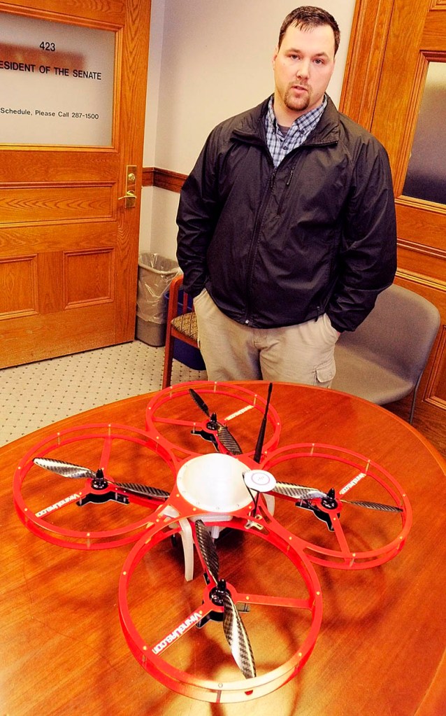 In this Feb. 26, 2013 file photo, Christopher Taylor, president and drone designer for Viking Unmanned Aerial Systems of Limington, talks about his company's FR-Xtreme model that is on the table at the State House in Augusta. Maine State Police believe a toy drone the agency purchased in January would be a “great reconnaissance tool,” according to internal agency records, but federal reulations suggest it would be illegal for police to use it.