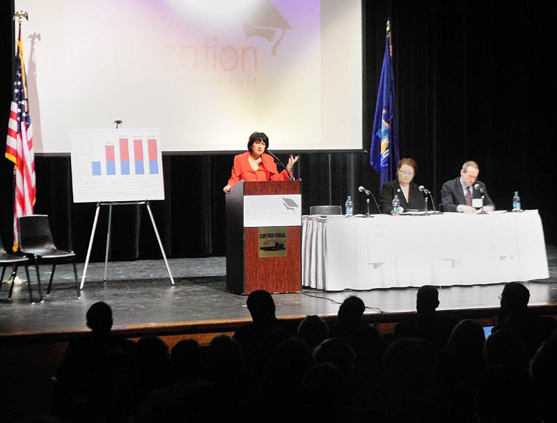 Staff photo by Joe Phelan Jeanne Allen, president of the Center for Education Reform, standing right, speaks during Governor�s Conference on Education: Putting Students First on Friday March 22, 2013 at Cony High School in Augusta.