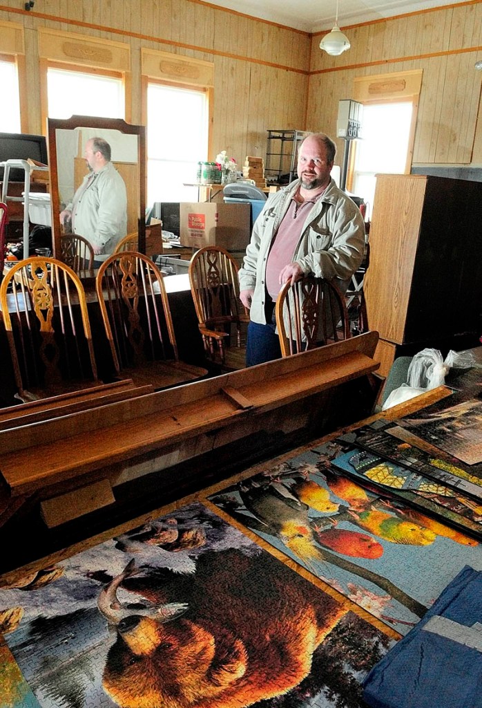 Michael Burgess Jr. stand in his shop Bottles and More Redemption Shop in North Monmouth on Thursday.