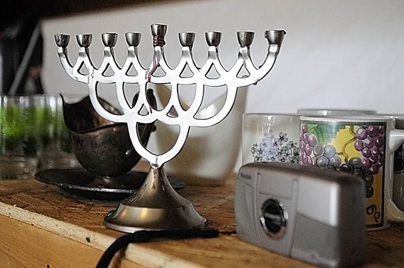 A menorah, metal gravy boat and digital camera are among the items for sale at Bottles and More Redemption Shop in North Monmouth.