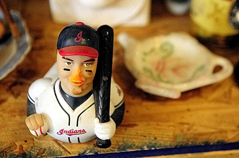 A Cleveland Indians baseball figurines is among the items at Bottles and More Redemption Shop in North Monmouth.