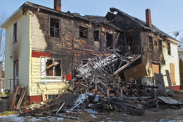 This file photo shows 146 Northern Avenue in Augusta the morning after it was heavily damaged by a fire on Thursday.