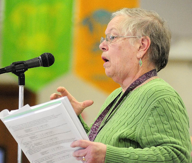 Jane Hubert participates in the debate during the Pittston town meeting on Saturday.