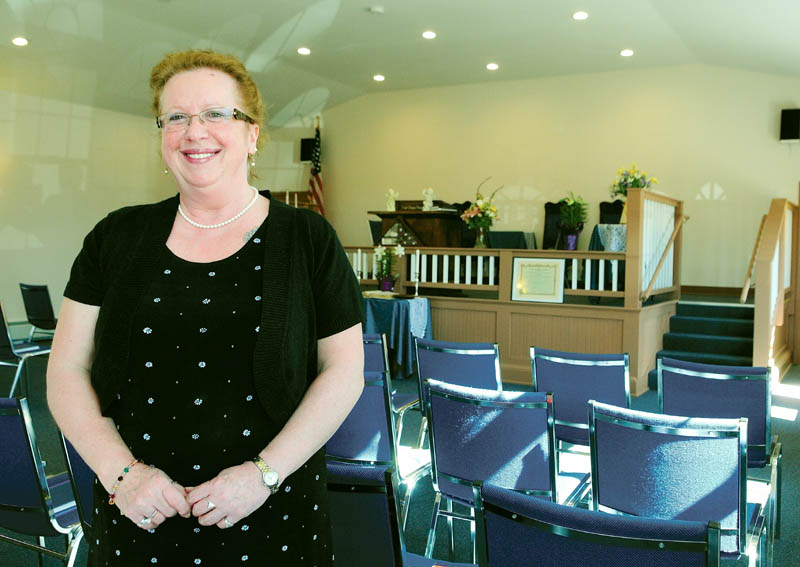 Augusta Spiritualist Church President Theresa Clifford stand in the group's new church on Saturday. It is located on Townsend Road, behind Barnes & Noble Booksellers.