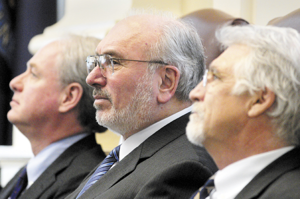 James Page, chancellor of the University of Maine System, left, John Fitzsimmons, president of the Maine Community College System and William Brennan, president of Maine Maritime Academy, sit in front of the House chamber before giving their State of Education addresses on Thursday at the State House in Augusta.
