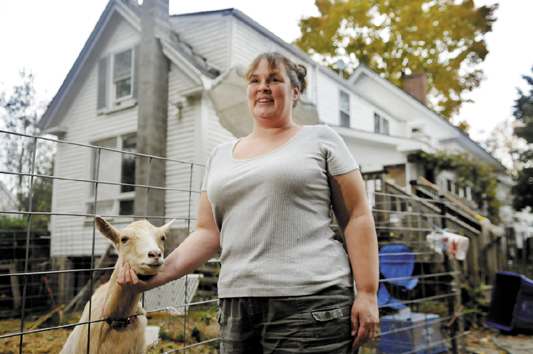 Marcina Johnston is raising goats with her family in the back yard of their Gardiner home in defiance of a city ordinance. Johnston hopes to change the ordinance to permit small farm animals within the urban compact.