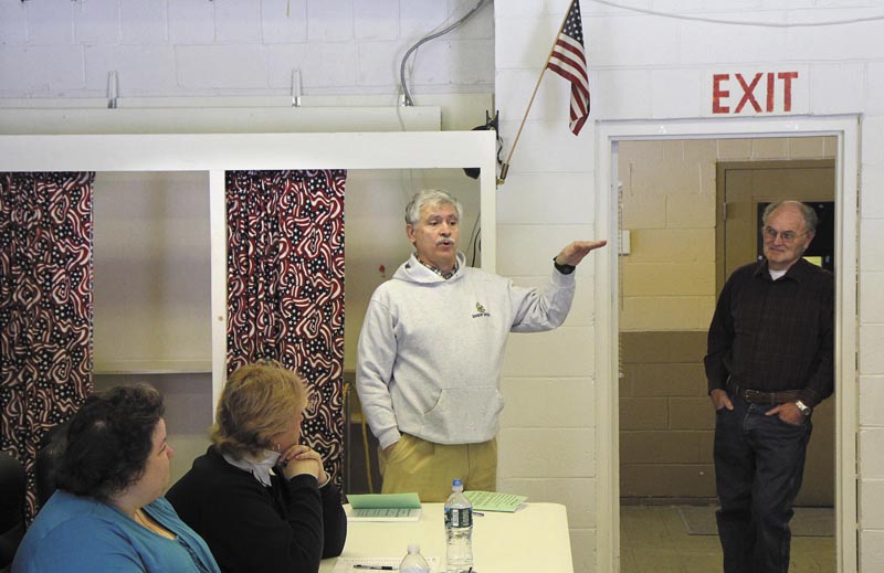State Sen. Tom Saviello, R-Wilton, addresses residents before the start of the Rome Town Meeting on Saturday. Saviello, who represents District 18, addressed current issues and took questions from residents while waiting for a quorum to arrive.