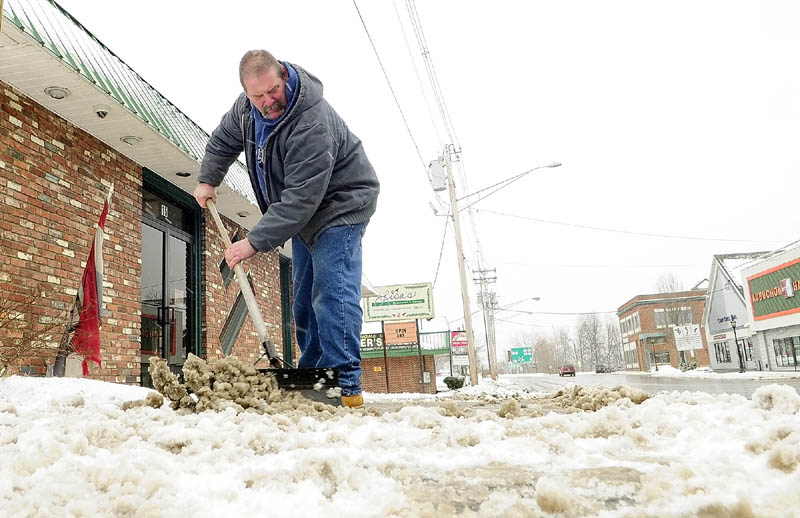 Don Berube shovels snow from a late winter storm in front of Lisa's Restaurant on Bangor Street in Augusta Tuesday. "It's an endless chore that's got to get done," Berube said. He'll probably be out shoveling that sidewalk on Bangor Street five or ten more times, he said.