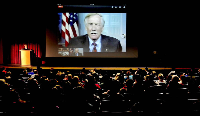 Sen. Angus King addresses Lawrence High School students via a Skype system at the Fairfield school on Wednesday. Principal Pam Swett is at the podium at left.