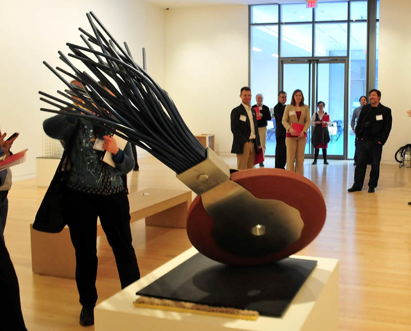 People view a sculpture of a typewriter eraser in the new Alfond-Lunder Family Pavilion, inside the Colby College Museum of Art in Waterville, on Monday.