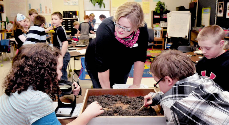 Kids at the Bloomfield Academy in Skowhegan learn about birds as L.C. Bates Museum Educator Serena Sanborn talks about the contents of owl pellets the kids picked through on Thursday. The pellets, regurgitated food that can not be digested, was sanitized for the class.