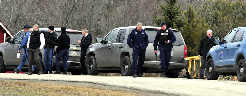 Maine State Police troopers and detectives converged at a residence on Barker Road in Troy on Wednesday. Police said a man shot himself at his home as he was about to be arrested for child sexual charges.
