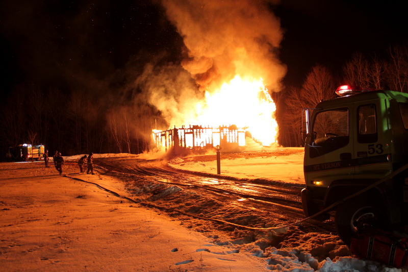 Firefighters battle the flames that destroyed Eric Whitehouse's Bean Road, Mount Vernon home early Sunday morning.