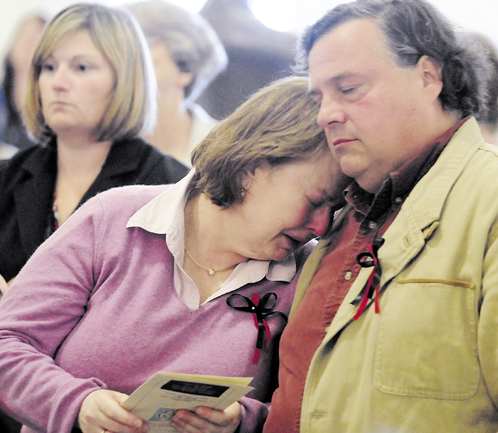 Donna Mills and her husband, Tim Mills comfort each other during a poem reading in September 2010, at the State of Maine 3rd Annual Day of Remembrance For Murder Victims ceremony held in the State House Hall of Flags in Augusta. Tim Mills on Monday testified in favor of L.D. 573, which would prevent murderers and class A felons from voting while incarcerated.