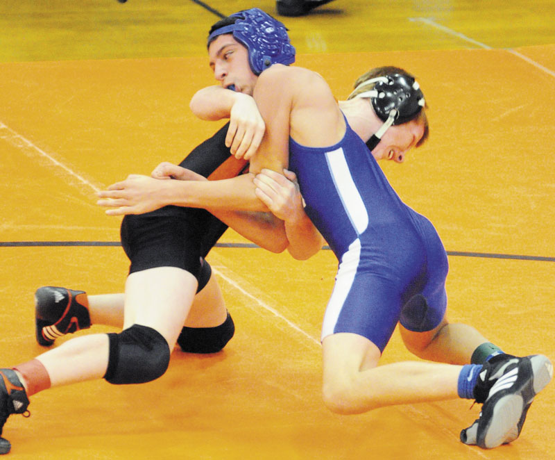 MAKING AN IMPACT: Gardiner’s Peter Del Gallo, back in black, and Erskine Academy’s Justin Studholme grapple during the 113-pound championship match of the Tiger Invitational earlier this years. Del Gallo, a freshman, won the 106-pound title at the New England championships on Saturday.