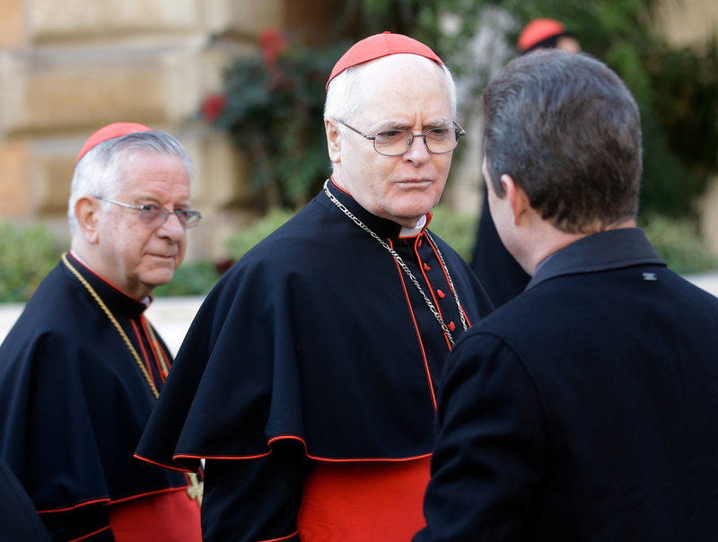 Cardinal Odilo Pedro Scherer of Brazil, center, is followed by compatriot Cardinal Geraldo Majella Agnelo, left, as they arrive for a meeting at the Vatican on Monday. Cardinals from around the world have gathered for their first round of meetings before the conclave to elect the next pope.