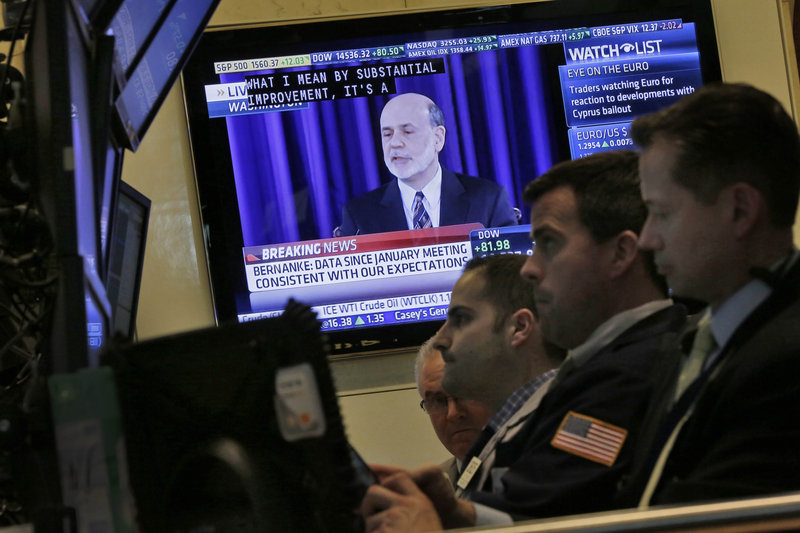 A television at the New York Stock Exchange shows Federal Reserve Chairman Ben Bernanke’s news conference Wednesday after a two-day meeting of the Fed.