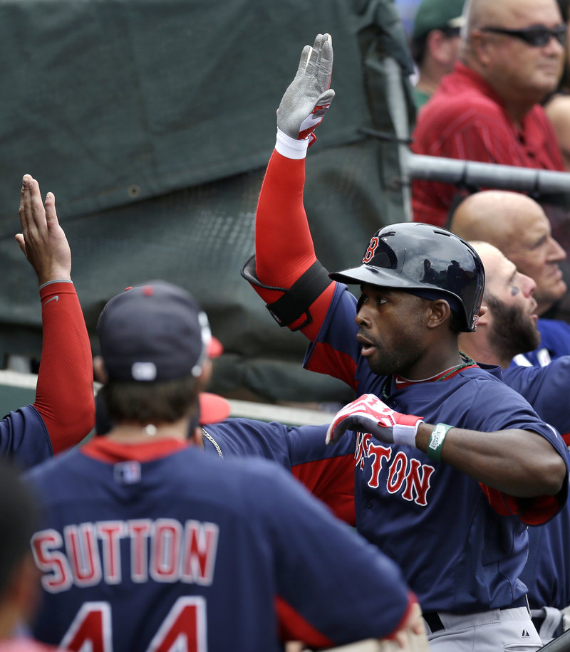 Jackie Bradley Jr. is congratulated by his teammates after hitting a three-run homer in the second inning of Boston’s exhibition game Sunday against the Philadelphia Phillies at Clearwater, Fla. Bradley finished with four RBI, and the Red Sox won, 7-6.