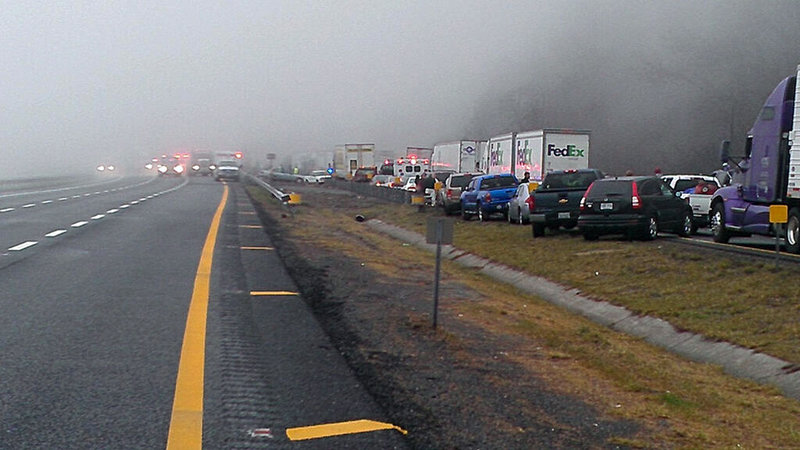 Traffic backs up for about 8 miles Sunday afternoon on Interstate 77 near the Virginia-North Carolina line, following a series of accidents near foggy Fancy Gap Mountain that resulted in the deaths of three people.