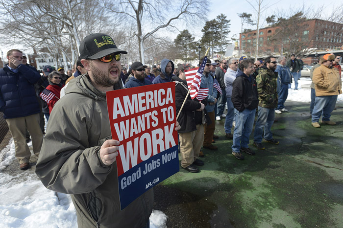 Brett Fralish of Newmarket, N.H., a Portsmouth Naval Shipyard employee, cheers during a demonstration on Thursday in Portsmouth, N.H., against the across-the-board federal spending cuts expected to cause yard workers to lose 20 percent of their pay over the next six months.