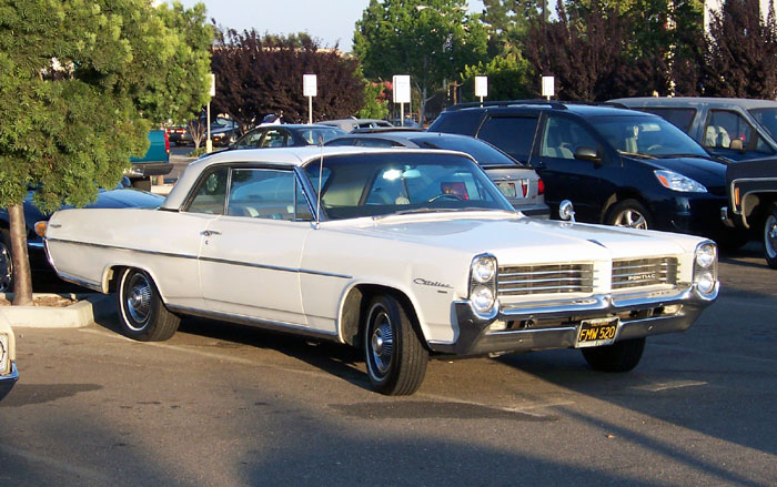 A white, 1964 Pontiac Catalina 2-door hardtop at the weekly Garden Grove, Calif. car show on July 23, 2004. Amy Calder's first car was a white Pontiac Catalina that would overheat if she drove more than five miles, a far cry from today's technology-laden, reliable automobiles.