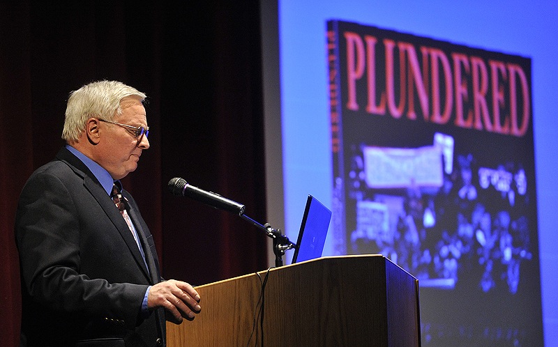 Michael Coffman discusses topics from his latest book, "Plundered: How Progressive Ideology is Destroying America," during a program at Lake Region High School on Saturday.