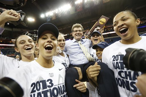 Connecticut players celebrate as they carry their head coach Geno Auriemma after defeating Louisville 93-60 in the national championship game of the women's Final Four of the NCAA college basketball tournament, Tuesday, April 9, 2013, in New Orleans. (AP Photo/Dave Martin)