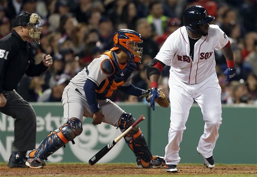 Boston Red Sox's David Ortiz, right, watches his two-run double in front of Houston Astros catcher Carlos Corporan, center, in the second inning of a baseball game in Boston, Saturday, April 27, 2013. (AP Photo/Michael Dwyer)