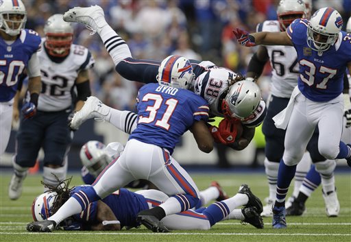 FILE - In this Sept. 30, 2012 file photo, Buffalo Bills' Jairus Byrd (31) upends New England Patriots' Brandon Bolden (38) during the first half of an NFL football game in Orchard Park, N.Y. Having not yet signed Buffalo's franchise-tag offer, Bills safety Jairus Byrd is not expected to attend the start of the team's three-day veteran voluntary minicamp that opens Tuesday, April 16, 2013. (AP Photo/Gary Wiepert, File)