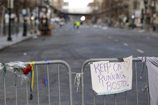 A sign hangs from a barricade on Boylston Street near the finish line of the Boston Marathon on Wednesday as the city continues to cope following Monday's explosions near the finish line of the marathon.