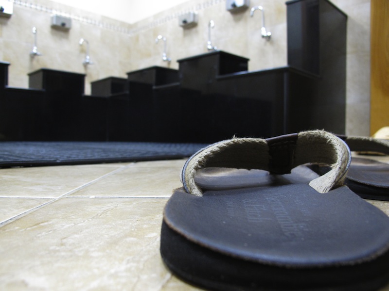 A pair of sandals sits on the floor in the washroom at the Islamic Society of Boston mosque in Cambridge, Mass., on Friday, April 19, 2013. A mosque official confirmed that the two suspects in the Boston Marathon bombings, who lived a short distance away, worshipped there occasionally. Tamerlan Tsarnaev ranted at a neighbor about Islam and the United States. His younger brother, Dzhokhar, relished debating people on religion, "then crushing their beliefs with facts." (AP Photo/Allen Breed)