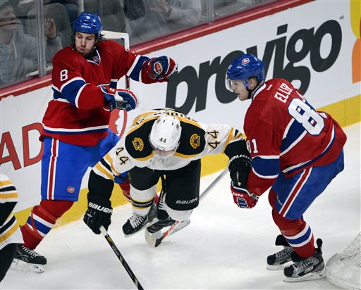 Boston Bruins defenseman Dennis Seidenberg (44) is sandwiched between Montreal Canadiens right wing Brandon Prust (8) and Canadiens center Lars Eller (81) during third-period NHL hockey game on Saturday, April 6, 2013, in Montreal. Montreal won 2-1. (AP Photo/The Canadian Press, Ryan Remiorz) Canada Quebec Montreal hockey;NHL;athlete;athletes;athletic;athletics;Canada;Canadian;competative;compete;competing;competition;competitions;game;games;League;National;play;player;playing;pro;professional;sport;sporting;sports;team Montreal Canadiens Bell Center Centre Bell Carolina Hurric