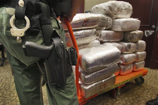 Bales of marijuana are wheeled out at a news conference in Jonesboro, Ga., in 2010, when 45 people were arrested and cash, guns and more than two tons of drugs were seized as part of an investigation by federal and local law enforcement into the Atlanta-area U.S. distribution hub of Mexico’s La Familia drug cartel.