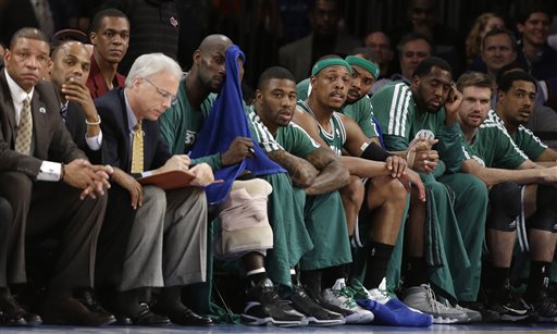 Boston Celtics head coach Doc Rivers, far left, injured guard Rajon Rondo, third from left, center Kevin Garnett, fifth from left, guard Terrence Williams, sixth from left, forward Paul Pierce, fifth from right, and forward Chris Wilcox, fourth from right, watch the fourth quarter of their first-round NBA basketball playoff series against the New York Knicks in New York, Tuesday, April 23, 2013. The Knicks won 87-71. (AP Photo/Kathy Willens)