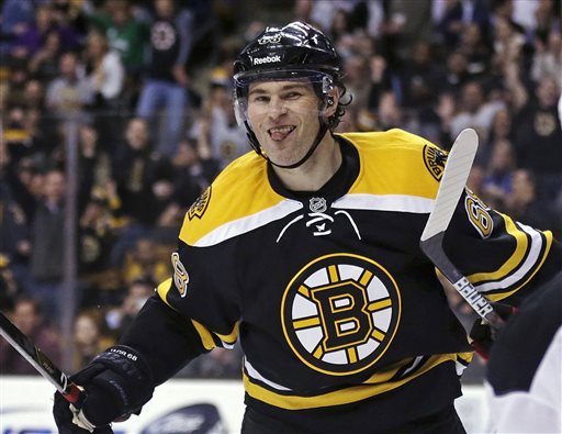 Boston Bruins right wing Jaromir Jagr sticks out his tongue after scoring in the second period of an NHL hockey game against the New Jersey Devils in Boston, Thursday, April 4, 2013. (AP Photo/Charles Krupa)