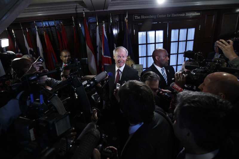 National School Shield Task Force Director, former Arkansas Rep. Asa Hutchinson speaks with reporters after a news conference at National Press Club in Washington on Tuesday. The National School Shield program is a framework to arm security guards in any school system who want to be part of the program.