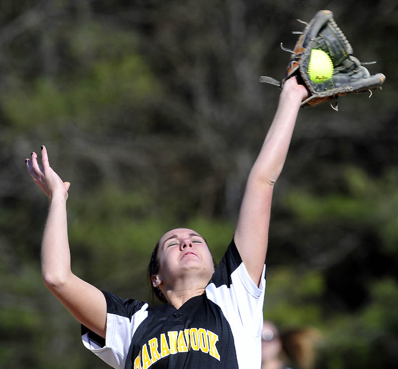 Maranacook Community School’s Mariah Vining grabs a popup at third base against Winslow High School on Tuesday in Readfield. Winslow won 4-2. For local roundup, see C3.