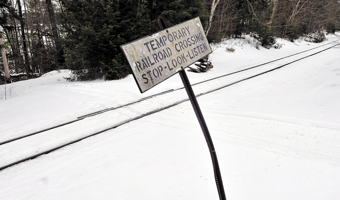 Snow covers the railroad crossing on Dustin Drive in Belgrade on Feb. 19. A bill that would have settled liability for railroad crossings on private land — and might have helped mitigate increased crossing fees being charged by Pan Am Railways — has been tabled.
