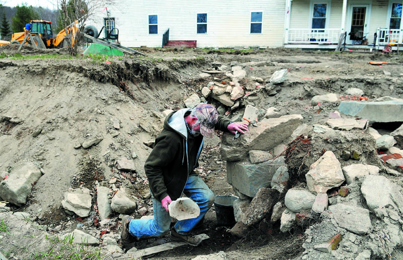 Maine Historic Preservation Commission employee Eric Lahti climbs up from the foundation of Fort Richmond Thursday April 18, 2013 in Richmond after sifting through the remains of the barricade, built in 1721.