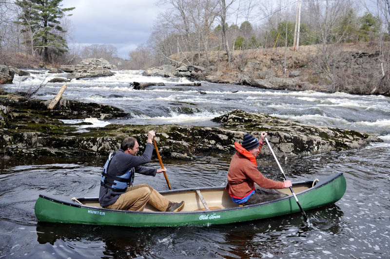 Haskell Padgett, of Whitefield, right, and Nathaniel Wing, of Edgecomb, descend falls on the Sheepscot River in Whitefield Sunday in a 13-foot canoe. The men were paddling down the river, charged with melted snow, to Head Tide in Alna, a 10-mile journey, they said.