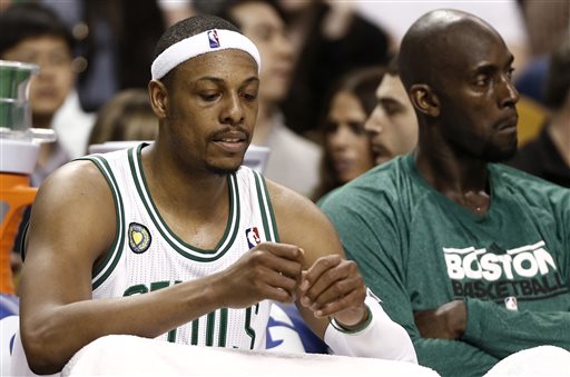 Boston Celtics' Paul Pierce, left, and Kevin Garnett sit on the bench during the fourth quarter of their 90-76 loss to the New York Knicks in Game 3 of a first round NBA basketball playoff series in Boston Friday, April 26, 2013. (AP Photo/Winslow Townson)
