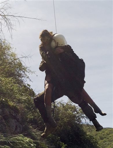 This photo provided by Los Angeles County Search and Rescue Reserve Deputy Doug Cramoline shows the helicopter rescue of Kyndall Jack, 18, by an L.A. County deputy after a rescue team found Jack clinging to an almost vertical canyon wall.