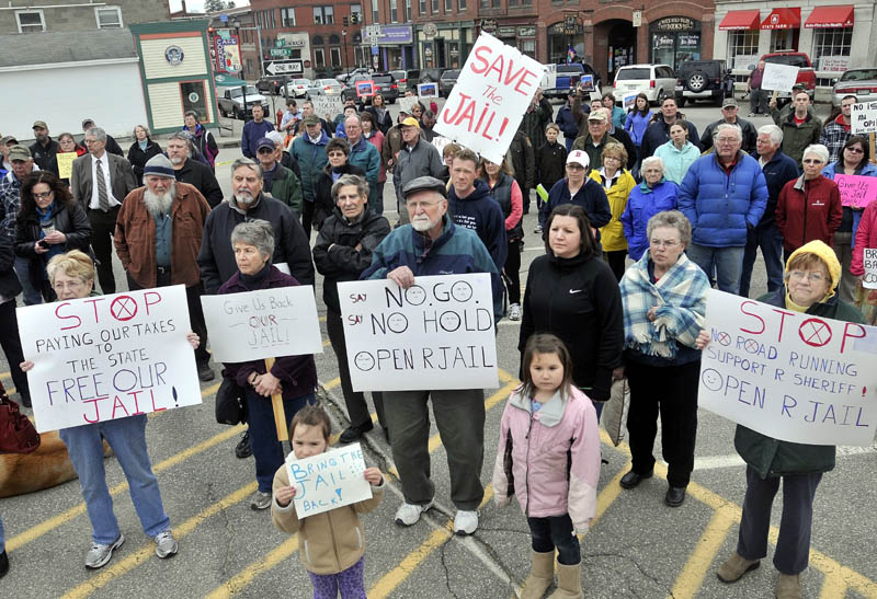 Protesters listen to Sheriff Scott Nichols, Sr., speaks during a protest at the Franklin County courthouse over the Franklin County Jail's reduction to a 72-hour holding facility in Farmington on April 10.