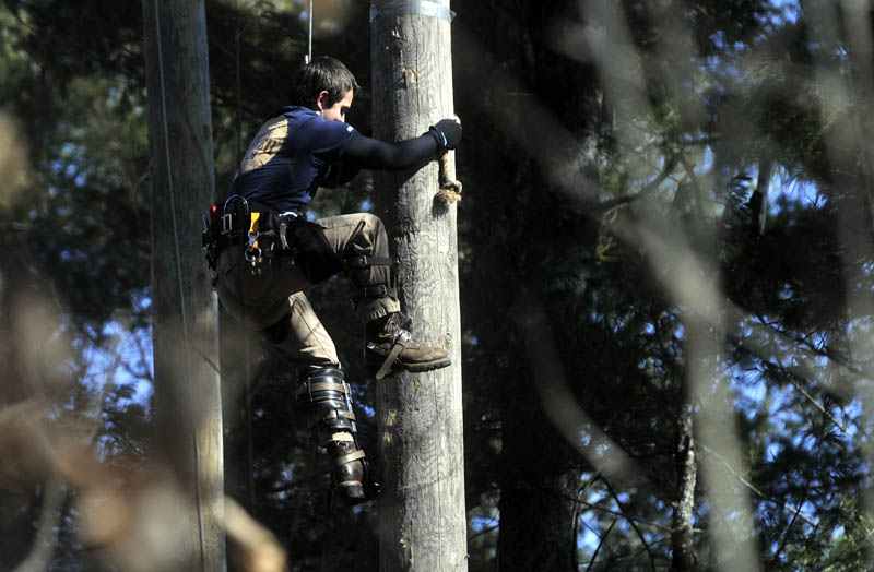 The pole climbing competittion at Colby College's annual Muddy Jack & Jill Meet in Waterville on Saturday.