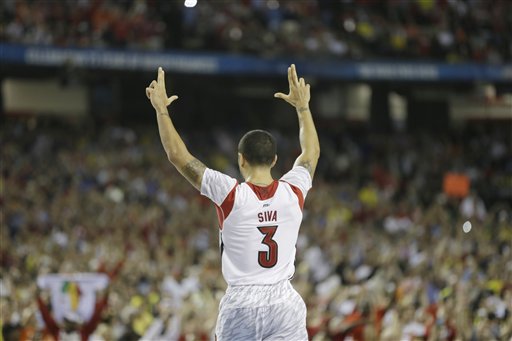 Louisville's Peyton Siva (3) gestures during the second half of the NCAA Final Four tournament college basketball championship game against Michigan Monday, April 8, 2013, in Atlanta. Louisville won 82-76. (AP Photo/Charlie Neibergall)