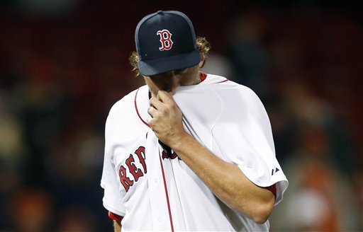 Boston Red Sox closer Joel Hanrahan wipes his face after being taken out after giving up five5 runs to the Baltimore Orioles in the ninth inning of Wednesday's game in Boston.